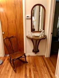 Petite antique rocker and attractive floating hall table with arched mirror.