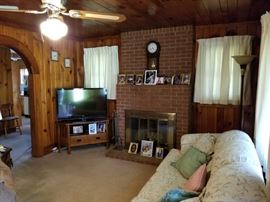 Floor lamp in corner goes as well.
