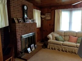 Chiming clock above fireplace goes.