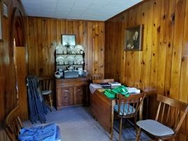 Dining room suite contains table with folding leaves, China cabinet and 6 chairs. China for sale as well.