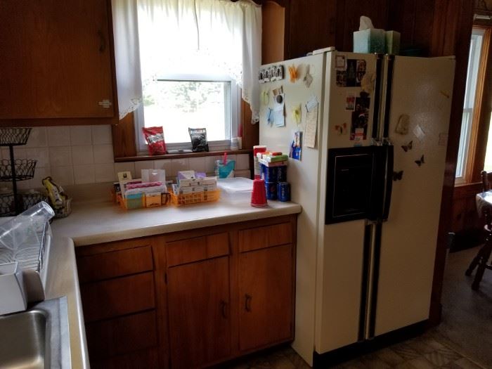 Refrigerator with freezer on left.