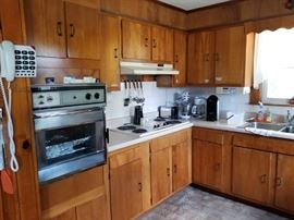Small kitchen appliances as well as assorted utensils included.
