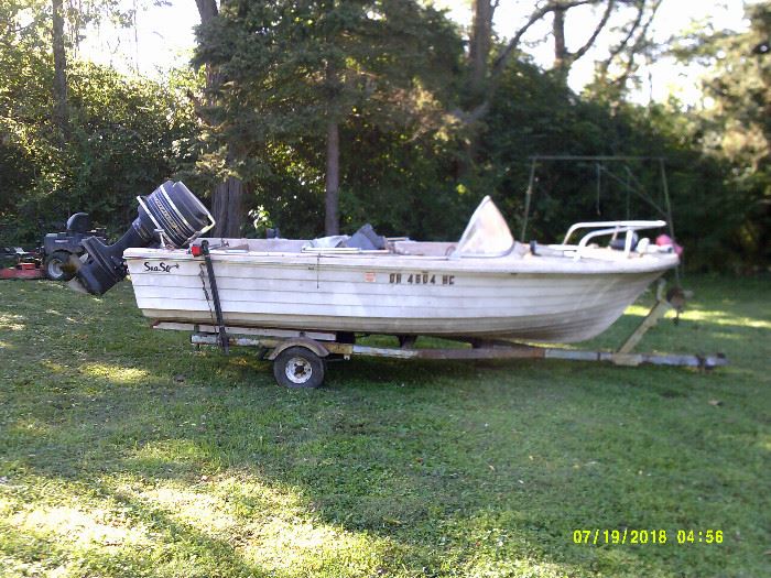 1967 14 ft Sea Star fiberglass boat with 65 hp outboard