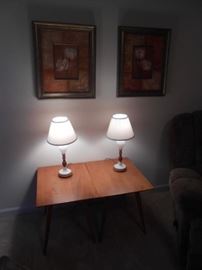 2 small lamps atop 2 very nice mid-century end tables