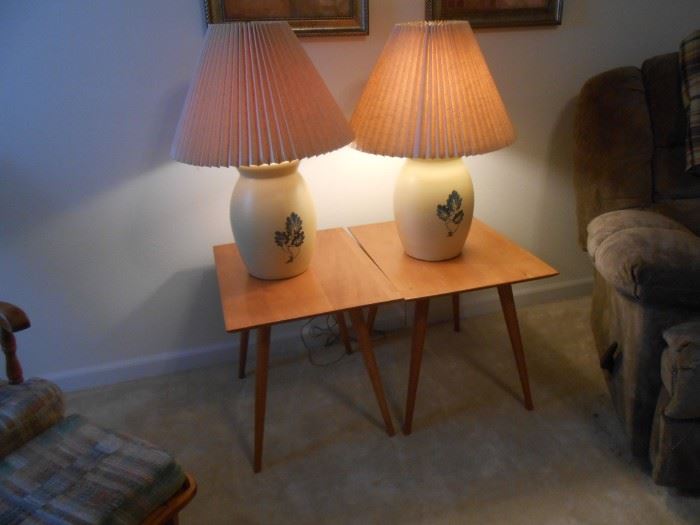 Larger pottery lamps atop the mid-century end tables