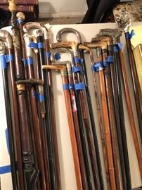 More antique canes, many sterling silver or figural