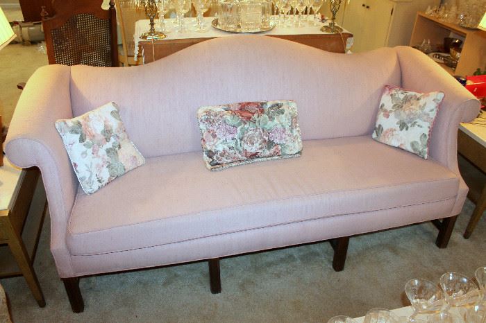 Pink upholstered camelback sofa