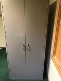 Metal cabinet that is about 6'6" by 40" in good condition. 
