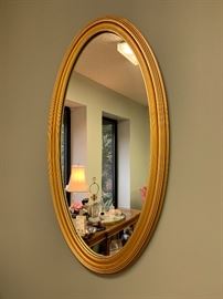 Beautiful and heavy gold mirror.