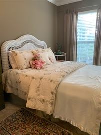 Wicker bedroom suite.  Several nice bedspreads and quilts.  