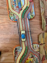 Great german childs city scape tin toy.  Complete with cars and technofix key to wind vehicles.  Box is available but not in great shape.  