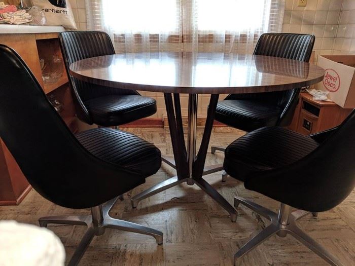 GREAT condition....no chips in table no tears in chairs.  Comfortable and retro!