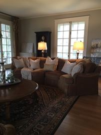 Pair of lovely and comfy traditional, arched four-seat sectionals from Maceys. Oversized, down filled pillows all zip off. Seat cushion covers also zip off. Each sectional is 11'x4' long, 3' deep and 33" high. Uphostery is in great condition. Retail price for each sectional $2000. Your price $1200 for both.