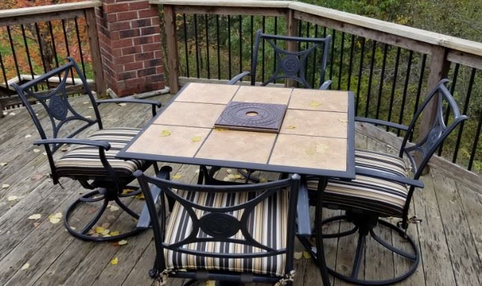 Fantastic patio set, wrought iron tiled table and four swivel chairs with cushions