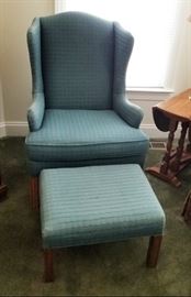 Blue upholstered chair and matching ottoman
