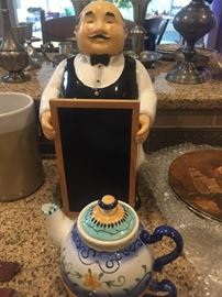 Cute waiter with chalkboard menu