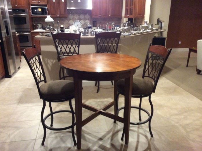 High top bar table and two table height stools, additional 2 counter height stools in background! Measures 37" x 36"
