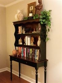 Painted table and bookcase style hutch.  Selection of books and decorative items.