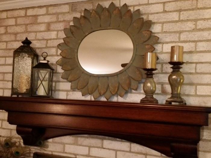 Painted metal framed mirror, matching candle sticks, and two glass lanterns.