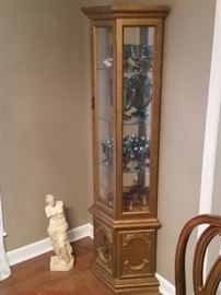 Gold painted lighted display cabinet with mirrored back.