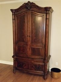 Armoire with lots of storage for either a TV or clothing. 