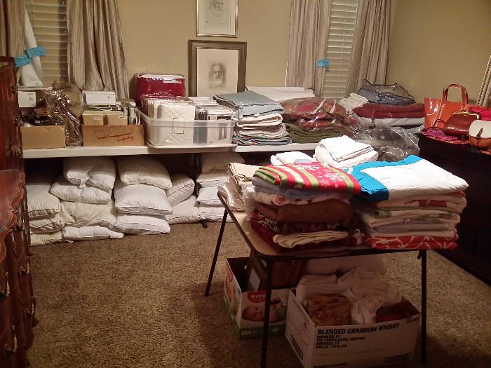 Lots of linens, sheet sets, comforters, quilts, blankets, all like new