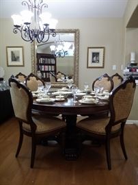 Dining table & six formal chairs with carved wood and upholstered seats & leans, large gold frame beveled mirror