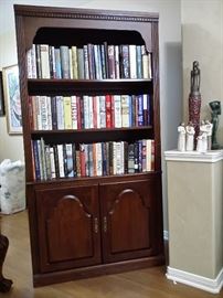Lighted bookcase & a variety of like new books 