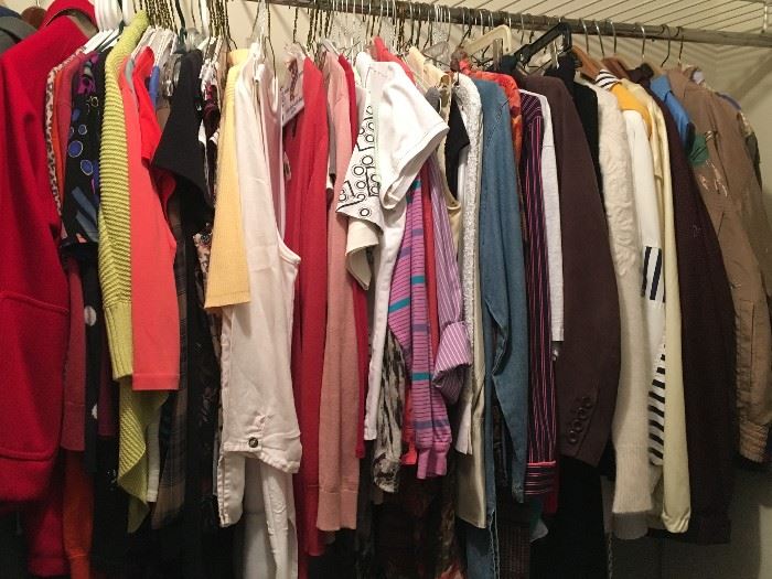 Closet packed with ladies clothing