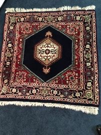 One of several colorful small rugs