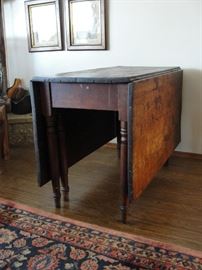 Drop Leaf Table 5' 3" long x 44" wide. Closed 21"