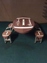 Plastic folding picnic table. Folds in half longwise and seats 4 kids.