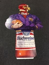 Football man is a cardboard cutout wearing a MN Viking jacket , 6' tall X 3'5" wide.