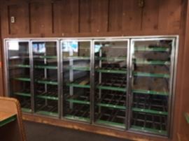 Each 5 door section is 11 feet long. The inside shelves are slanted and 6 feet long X 2 feet wide.