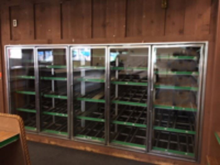 Each 5 door section is 11 feet long. The inside shelves are slanted and 6 feet long X 2 feet wide.