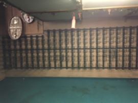 Wall mounted wine racks with adjustable shelves.