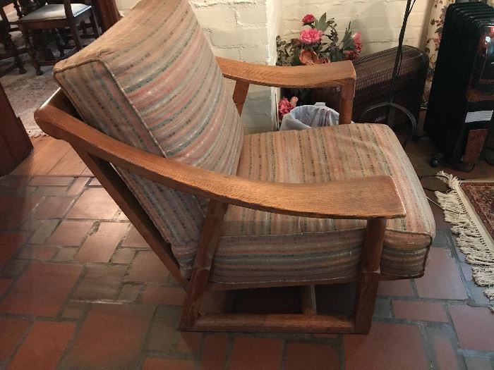 An oak lounge chair, has a matching sofa