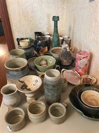 Another table of hand made pottery. 