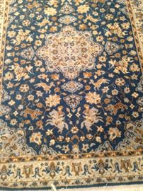 Rug - 4 feet x 5 feet in tan, brown, and blues