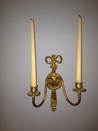 One of two brass sconces