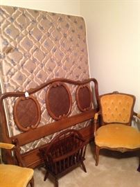 Queen bed; parlor chairs; magazine rack