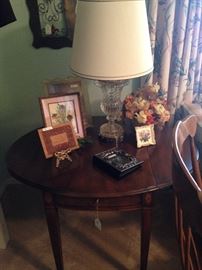 One of two drop leaf side tables