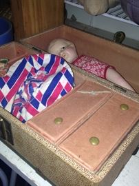 Vintage doll in trunk