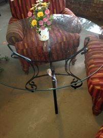 Glass top table; two of four matching chairs