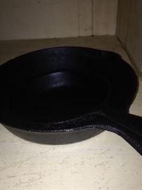 Large and small iron skillets
