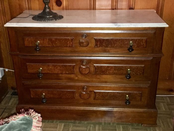 Marble top chest with teardrop pulls and 3 drawers