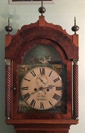 Hand painted face on antique grandfather clock