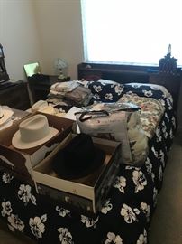 Double bed and men’s hats