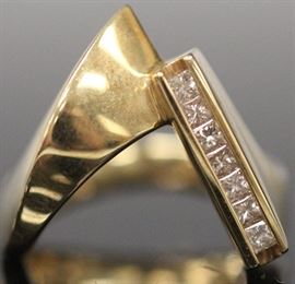 LOT #7351 - LADY'S CHANNEL SET DIAMOND 14KT GOLD RING