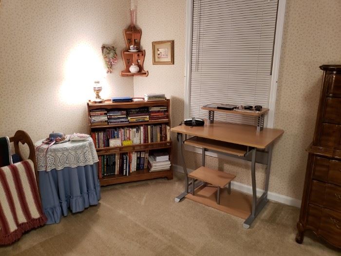Desk, bookcase and more books